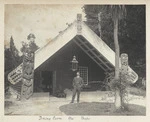 Dining room, Spa Hotel, Taupo, and man standing outside; shows a Maori meeting house