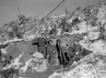 Command Post personnel of E Troop, 163 Bty pose outside their command post after one of the first snowfalls of the new year