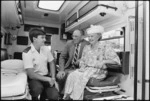 Shirley and Alan Martin inside the ambulance named after them, with Wellington Free Ambulance officer David Long - Photograph taken by John Nicholson