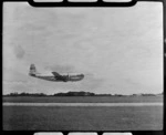 Pan American Airways Clipper Rainbow taking off at Whenuapai