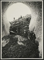 Group standing in an ice cave, Mueller Glacier