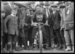 Ernie Hinds on an Indian 1000cc motorcycle, New Brighton Beach, Christchurch, with crowd