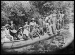 Men and women on a canoe, Hamurana Springs, Lake Rotorua