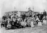 Pupils and teachers alongside the flag pole at Roseneath School, Wellington