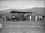 Pilot Thomas Newman, and others, alongside the first aircraft to land at Nelson