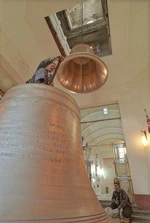 Engineer Martin Halcrow hoisting bells into the National War Memorial Carillon, Wellington - Photograph taken by Ross Giblin