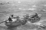 Crew in Worser Bay Surf Life Saving Club boat Miss Europa II, competing in a Lion Brown marathon surf boat race, Wellington
