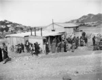 Group of people around a building during the depression, Wellington