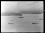 Royal Yacht Britannia with destroyer escort and submarine, Bay of Islands