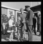 Air crew talking to two unidentified children, Taupo Aerodrome test, South Pacific Airlines of New Zealand (SPANZ)