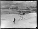 Skiers using Coronet Peak rope tow