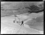 Skiers using Coronet Peak tow