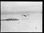 Flying boat, Centaurus, flying low over Wellington Harbour