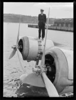 Crew member, standing on the flying boat, Centaurus, Dunedin Harbour