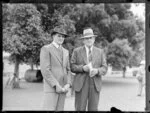 Mr Kennedy with unidentified man at horse auctions, Alexandra Park, Auckland