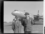 John Gamble, left, with Nick Higgs, Handley Page Hastings airplane in background, location unidentified