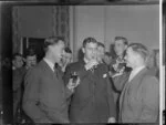 Unidentified man, with Squadron Leader HG Hazelden, centre, and Mr Crossly, left, at a social gathering