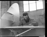 Airwork New Zealand Ltd, Mr M R McFadden working on tail of Moth aircraft