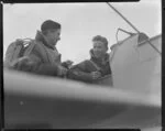 Cadet E Arundel in cockpit of aircraft and cadet N F Fraser, Wigram, Christchurch