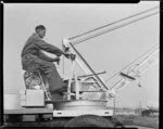 Shell Oil NZ Ltd, operator working the mobile crane, no 63, [Auckland?]