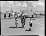 Mrs Gould, the Paraparaumu airport hostess, with passengers