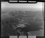 Lake Waikaremoana, Wairoa District, featuring cliffs and native forest