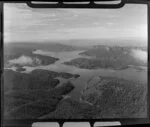 Lake Waikaremoana, Wairau District, featuring native forest and cliffs