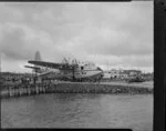 TEAL (Tasman Empire Airways Limited) staff, servicing the Solent flying boat 'Awatere', Mechanics Bay, Auckland