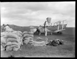 Loading aircraft at Mangere for aerial topdressing flight