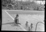 Qantas Empire Airways, children in the swimming pool at Berrimah, Darwin, Australia