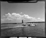 Tasman Empire Airways Ltd aircraft taking off, Mechanics Bay, Auckland