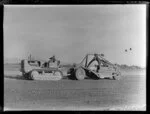 Men working with heavy machinery to make extensions to Harewood Airport, Christchurch