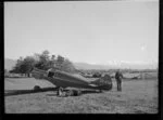 Harry Wigley beside a Miles Whitney Straight aircraft, Timaru