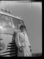 Driver of Luxury Landliner standing at the front of the coach, Tongariro National Park