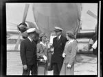 Pan American World Airways, flight crew standing in front of a Stratocruiser aircraft at Whenuapai Airbase, Auckland