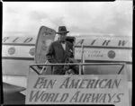 Pan American World Airways, unidentified man standing in front of Stratocruiser aircraft at Whenuapai Airbase, Auckland