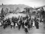 Children at a penny scramble on Trafalgar Street, Nelson