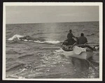 Boat with Captain Herbert Cook and three unidentified men in pursuit of whale