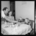 Pencarrow lighthouse keeper Mr R G Jones, and family, having a meal