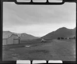 Auster aircraft on the ground beside Omarama Memorial Hall, Waitaki County