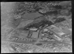 Mount Eden, Auckland, view over the Colonial Ammunition Company plant with shot tower next to The Kauri Timber Co Ltd, Normanby Road, with residential housing and Auckland Grammar School