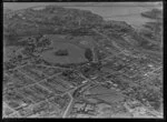 Newmarket Borough, Auckland City, view of Auckland Domain with Auckland Public Hospital, Mount Eden Prison, railway line, Auckland Grammar School, Auckland City Centre and Hobson Bay beyond