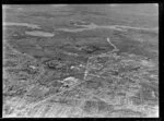 Showing Penrose Southern Motorway under construction, Auckland City area, with Great South Road and railway, intersecting with Pakuranga Highway, residential and commercial buildings, farmland beyond