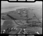 Glendowie, Auckland City, view south from Churchill Park with Riddell Road to Kerridge family home surrounded by farmland, with Panmure and estuary beyond