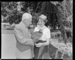 Unidentified man and woman with a kiwi bird at Auckland Zoo