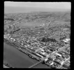 View of Victoria Avenue and Cooks Gardens, Wanganui, with railyards and wharf, commercial and residential buildings, cricket grounds and racecourse beyond