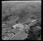 Wanganui, closeup view over Kempthorne Prosser Chemical Works between Brunswick Road and railway yard, hilly farmland beyond