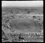 Wanganui, Gonville, closeup of racecourse and Spriggens Park and Jacksons Street with residential housing, with the Whanganui River and farmland beyond