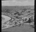 Helensville, Auckland, showing Mill Road and Commercial Road (part of State Highway 16), dairy factory and Kaipara River