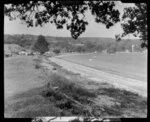 Matakatia, Whangaparaoa Peninsula, showing houses and beach